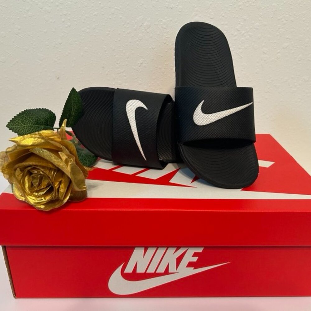 Size 3Y Black Nike Kawa slides, with white swoop on strap
